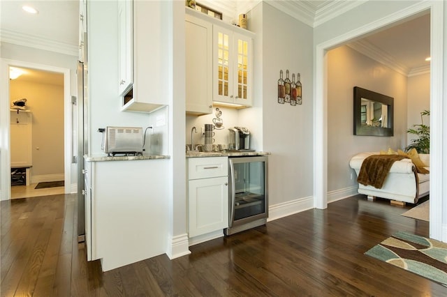 203 Ironwood Ct, Peters Twp, PA 15367 - indoor wet bar featuring beverage cooler, dark wood finished floors, ornamental molding, and recessed lighting