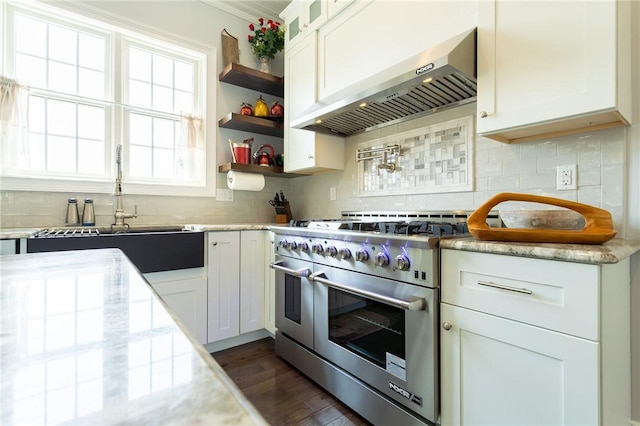 203 Ironwood Ct, Peters Twp, PA 15367 - kitchen featuring range hood, range with two ovens, white cabinets, and decorative backsplash