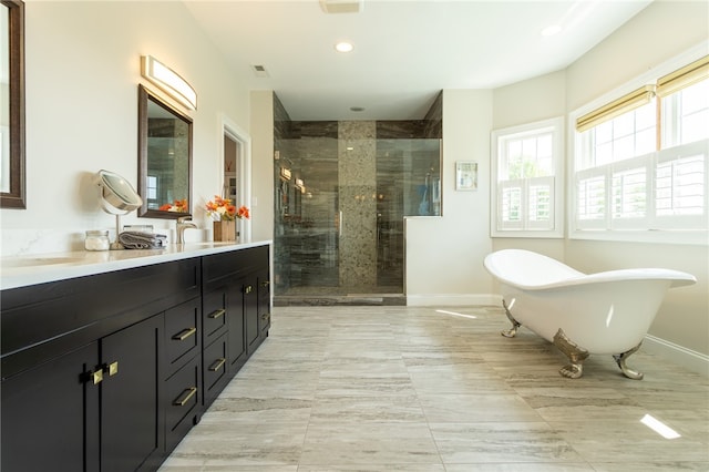 203 Ironwood Ct, Peters Twp, PA 15367 - full bath featuring a stall shower, double vanity, a soaking tub, and recessed lighting