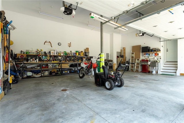 203 Ironwood Ct, Peters Twp, PA 15367 - garage featuring a garage door opener and a workshop area