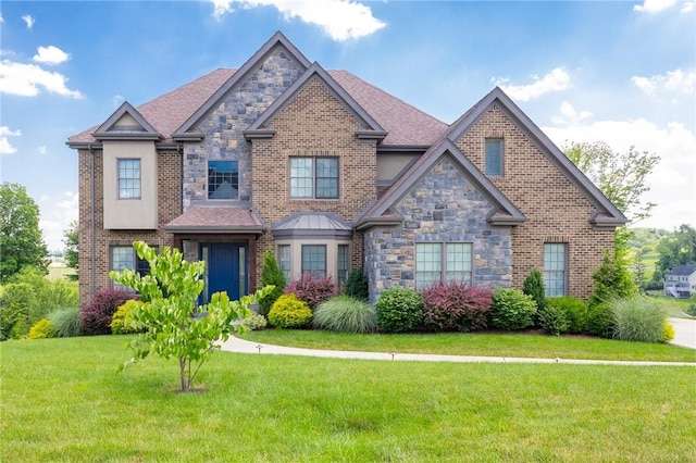 203 Ironwood Ct, Peters Twp, PA 15367 - craftsman house featuring a front yard, stone siding, and brick siding