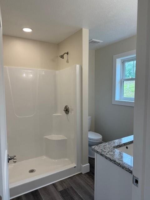 3273 Brodhead Rd Unit D, Center Twp Bea, PA 15001 - bathroom featuring wood finished floors, vanity, a shower, and a textured ceiling