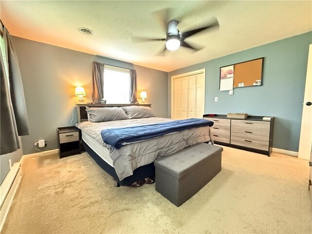 84 Williamson Rd, Hempfield Twp Mer, PA 16125 - bedroom with light colored carpet, a closet, a ceiling fan, and baseboard heating