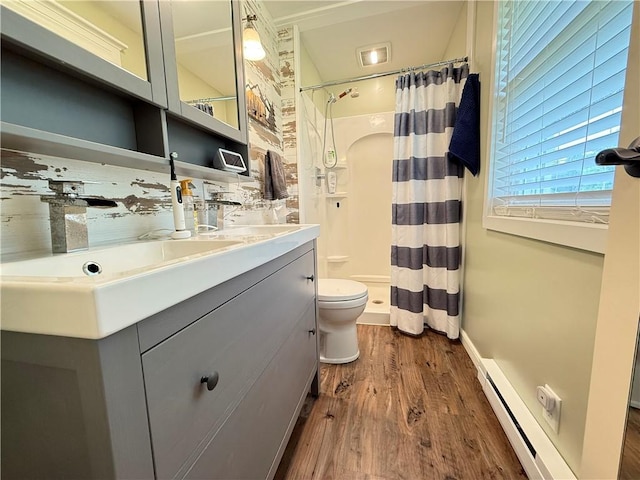 84 Williamson Rd, Hempfield Twp Mer, PA 16125 - full bathroom with baseboard heating, wood finished floors, vanity, and a shower with curtain
