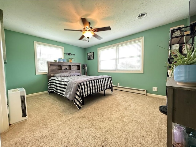 84 Williamson Rd, Hempfield Twp Mer, PA 16125 - bedroom featuring a baseboard radiator, carpet flooring, heating unit, a ceiling fan, and a textured ceiling