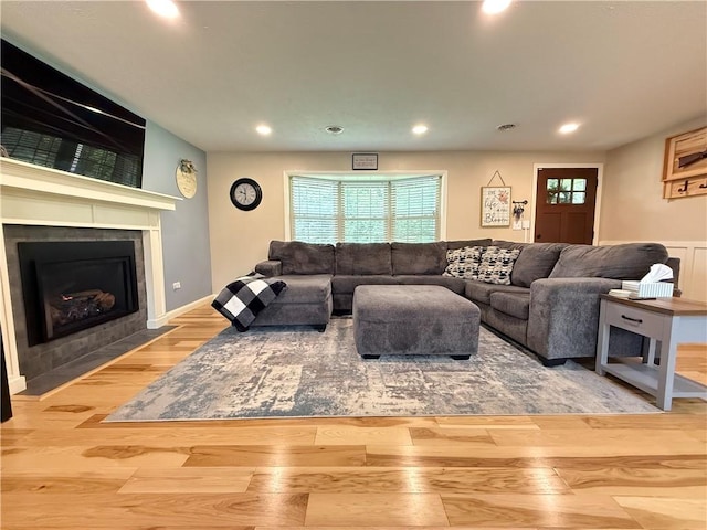 84 Williamson Rd, Hempfield Twp Mer, PA 16125 - living room featuring wood finished floors, recessed lighting, and a tiled fireplace