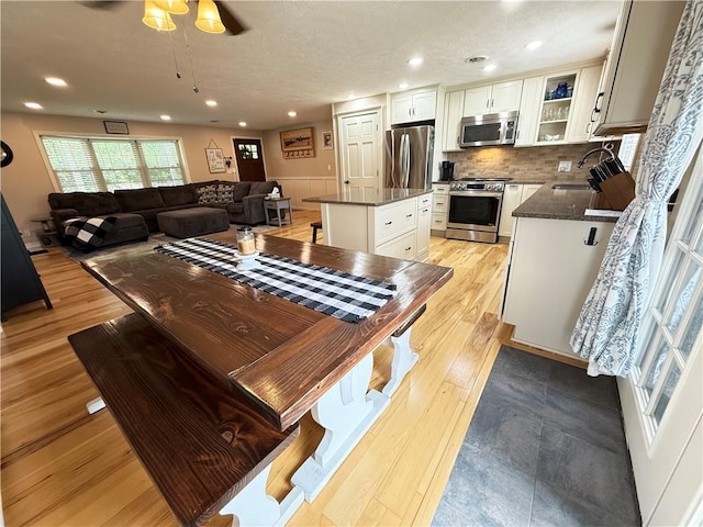 84 Williamson Rd, Hempfield Twp Mer, PA 16125 - dining space featuring ceiling fan, light wood finished floors, recessed lighting, and wainscoting