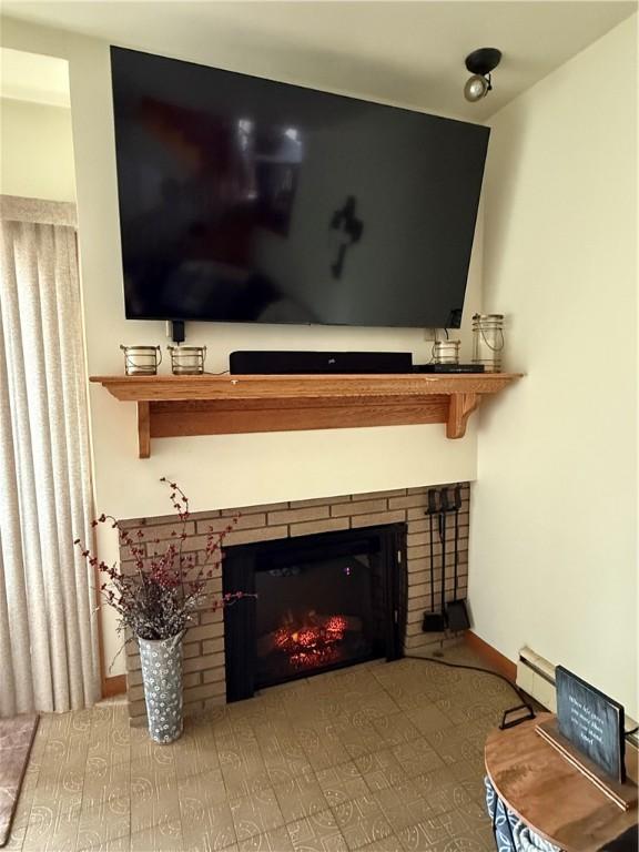 570 Hancock St, Cherryhll Twp/Clymer, PA 15728 - detailed view of baseboard heating and a fireplace