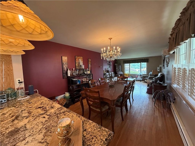 570 Hancock St, Cherryhll Twp/Clymer, PA 15728 - dining area featuring a chandelier, a baseboard radiator, and hardwood / wood-style floors