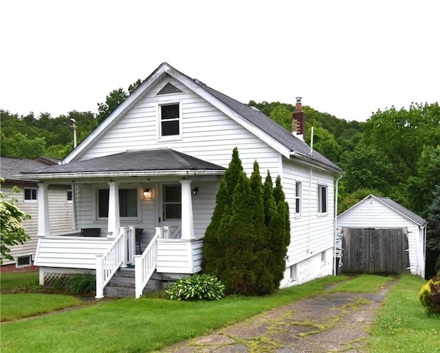 117 Oregon Ave, Vandergrift Wml, PA 15690 - bungalow-style home with a porch, a front lawn, and a chimney