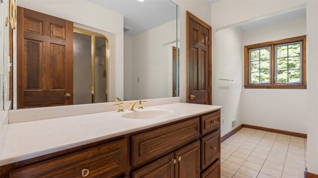 105 Bristol Sq, Ohara, PA 15238 - bathroom featuring vanity, tile patterned flooring, and a shower with door