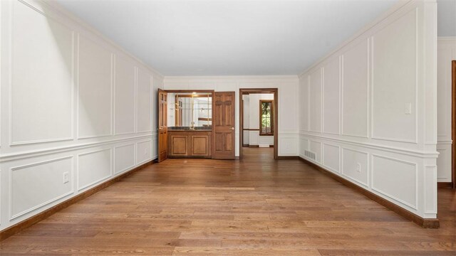 105 Bristol Sq, Ohara, PA 15238 - empty room featuring a decorative wall and light wood-style floors