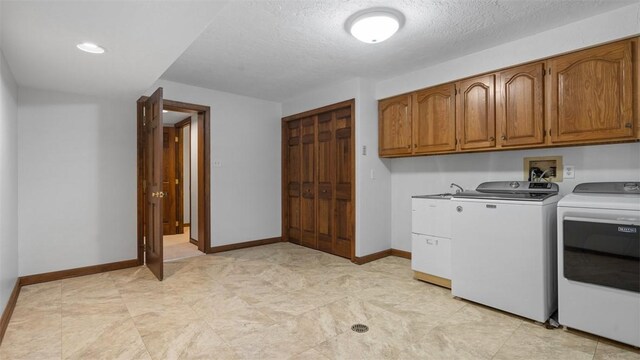 105 Bristol Sq, Ohara, PA 15238 - washroom featuring cabinet space, washer and clothes dryer, and a textured ceiling