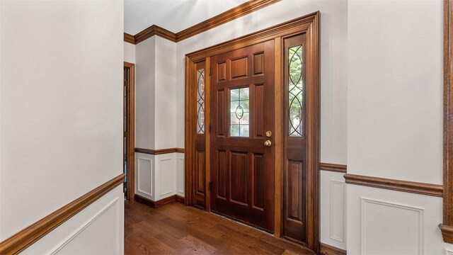 105 Bristol Sq, Ohara, PA 15238 - foyer with ornamental molding, dark wood-type flooring, a decorative wall, and a wainscoted wall