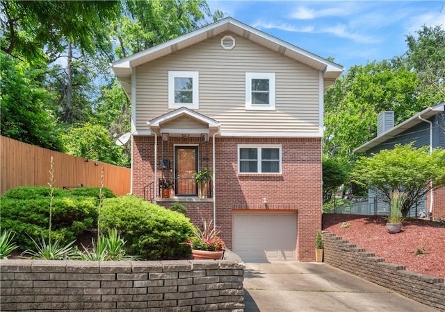 404 Chautauqua St, Perry Hilltop, PA 15214 - view of front of house featuring driveway, brick siding, and a garage