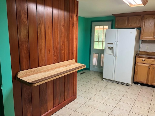113 Filer Ln, Clay Twp, PA 16001 - kitchen with white fridge with ice dispenser and light tile patterned flooring