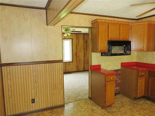 289 Sheridan Ln, Carmichaels/Cumblnd, PA 15351 - kitchen with black microwave, a ceiling fan, brown cabinets, crown molding, and tasteful backsplash