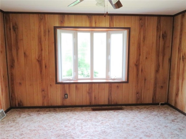 289 Sheridan Ln, Carmichaels/Cumblnd, PA 15351 - spare room with a ceiling fan, wood walls, and carpet flooring