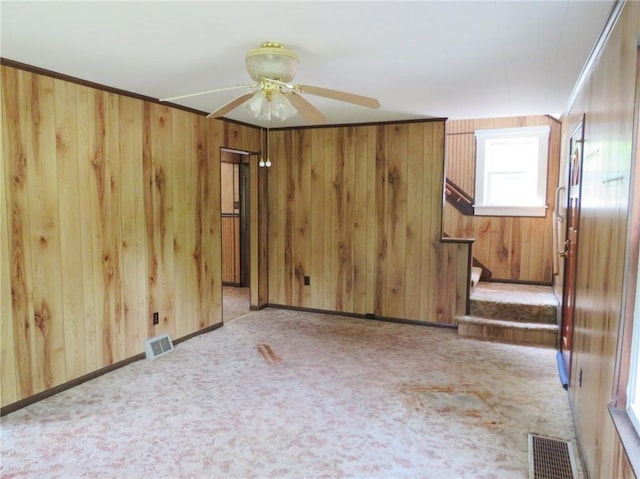 289 Sheridan Ln, Carmichaels/Cumblnd, PA 15351 - unfurnished room with ceiling fan, wooden walls, stairs, and carpet floors