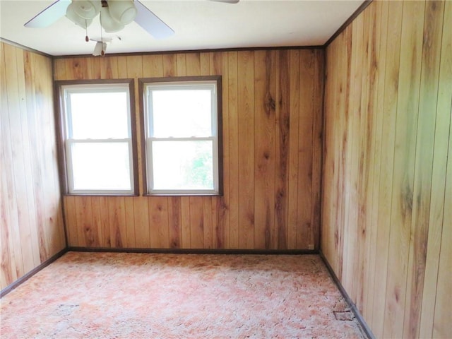 289 Sheridan Ln, Carmichaels/Cumblnd, PA 15351 - spare room featuring a ceiling fan, wooden walls, and light colored carpet