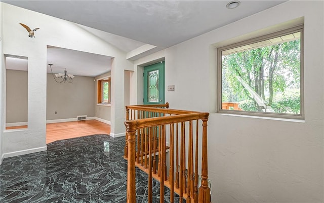 116 Parkfel Ave, Mccandless, PA 15237 - hall with a chandelier, an upstairs landing, and vaulted ceiling