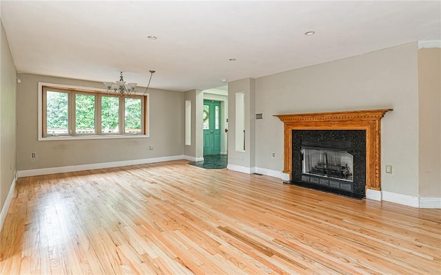 116 Parkfel Ave, Mccandless, PA 15237 - unfurnished living room with light wood-style flooring, a chandelier, a premium fireplace, and recessed lighting