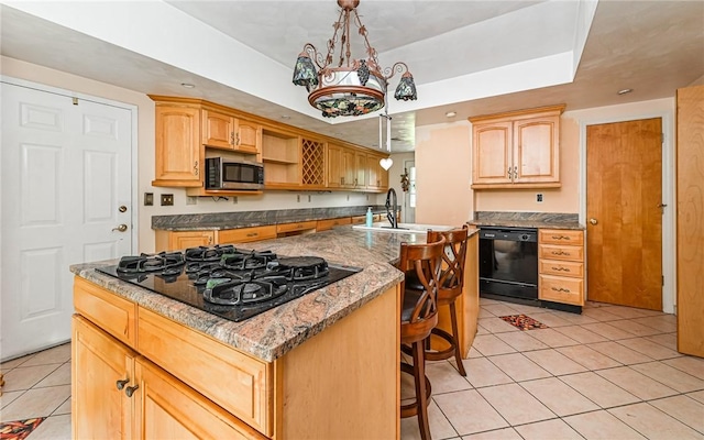 116 Parkfel Ave, Mccandless, PA 15237 - kitchen with black appliances, light tile patterned flooring, a kitchen breakfast bar, light brown cabinets, and a center island with sink