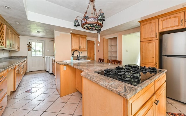 116 Parkfel Ave, Mccandless, PA 15237 - kitchen with freestanding refrigerator, black gas stovetop, light tile patterned flooring, a center island, and light stone countertops