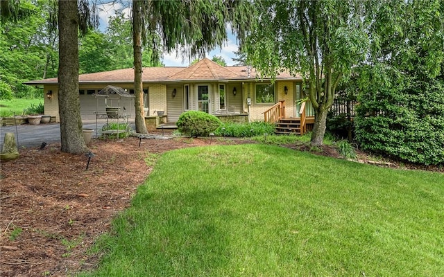 116 Parkfel Ave, Mccandless, PA 15237 - single story home featuring a front lawn, asphalt driveway, brick siding, and an attached garage