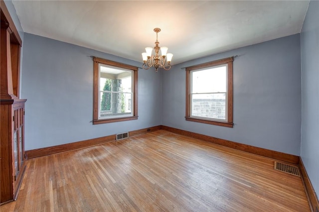 438 Miami St, East Mckeesport, PA 15035 - spare room featuring a chandelier and light wood finished floors