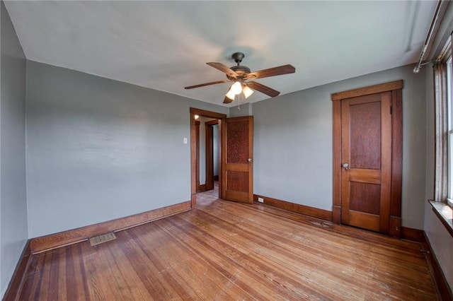 438 Miami St, East Mckeesport, PA 15035 - empty room with ceiling fan and light wood finished floors