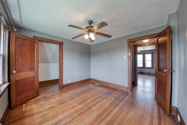 438 Miami St, East Mckeesport, PA 15035 - empty room with light wood finished floors and a ceiling fan