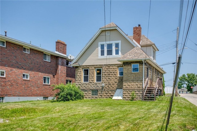 438 Miami St, East Mckeesport, PA 15035 - back of property with a lawn and a chimney
