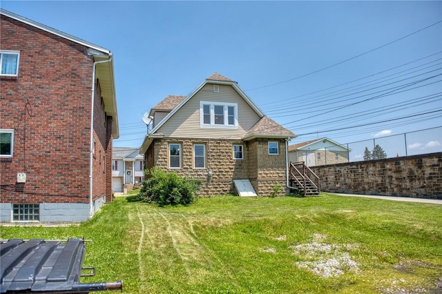 438 Miami St, East Mckeesport, PA 15035 - back of property with a lawn and brick siding