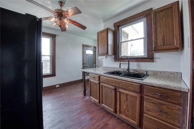 438 Miami St, East Mckeesport, PA 15035 - kitchen featuring freestanding refrigerator, ceiling fan, dark wood-type flooring, brown cabinets, and light countertops