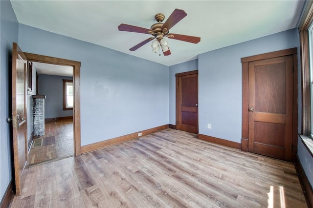 438 Miami St, East Mckeesport, PA 15035 - unfurnished bedroom with light wood finished floors, a ceiling fan, and a closet