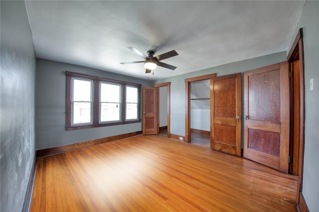 438 Miami St, East Mckeesport, PA 15035 - unfurnished bedroom with light wood-style flooring, multiple closets, and ceiling fan