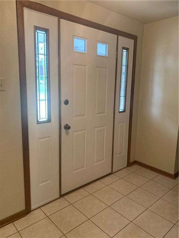 111 Brandywine Dr, Manor, PA 15642 - entryway with baseboards and light tile patterned floors
