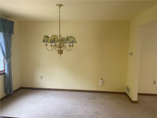 111 Brandywine Dr, Manor, PA 15642 - unfurnished dining area with a chandelier and light colored carpet