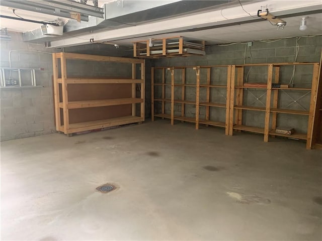111 Brandywine Dr, Manor, PA 15642 - garage with a garage door opener and concrete block wall