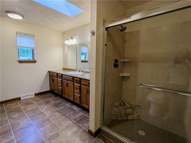 350 American Legion Rd, Unity Twp, PA 15650 - full bath with a skylight, vanity, a stall shower, and tile patterned flooring
