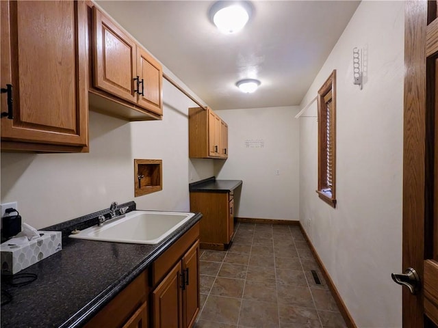 350 American Legion Rd, Unity Twp, PA 15650 - kitchen featuring dark countertops and brown cabinets