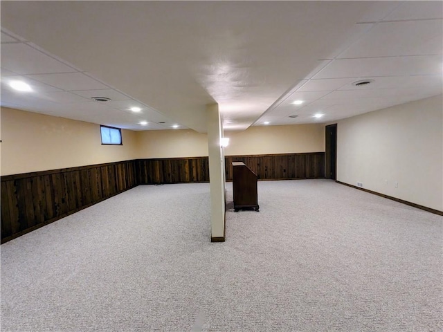 350 American Legion Rd, Unity Twp, PA 15650 - basement with light carpet, wooden walls, a wainscoted wall, a paneled ceiling, and recessed lighting