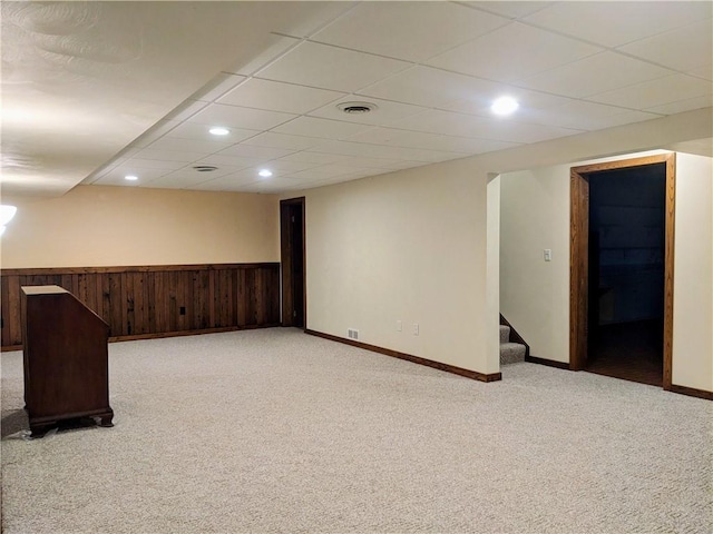 350 American Legion Rd, Unity Twp, PA 15650 - finished basement featuring light colored carpet, stairway, recessed lighting, wooden walls, and a wainscoted wall