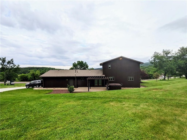 350 American Legion Rd, Unity Twp, PA 15650 - rear view of property featuring a jacuzzi, a patio, and a yard