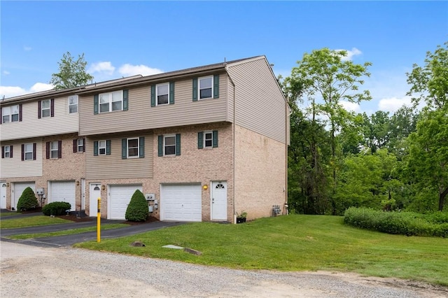 130 Pine Ct, Plum Boro, PA 15239 - multi unit property with driveway, a garage, brick siding, and a front lawn