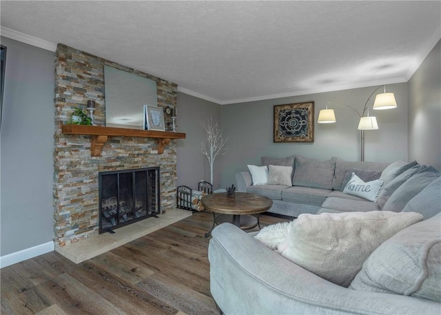 1415 Ashwood Cir, Upper St Clair, PA 15241 - living area with wood finished floors, crown molding, a textured ceiling, and a stone fireplace