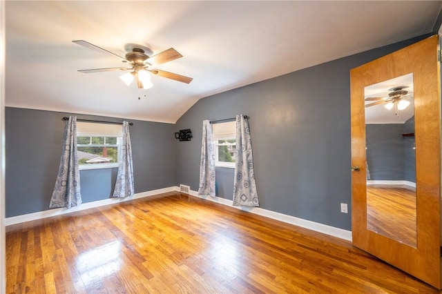 524 Saint Andrews Dr, Hempfield Twp Wml, PA 15601 - unfurnished room with a ceiling fan, plenty of natural light, vaulted ceiling, and wood finished floors