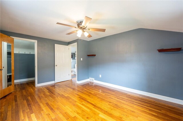 524 Saint Andrews Dr, Hempfield Twp Wml, PA 15601 - unfurnished bedroom with wood finished floors, ceiling fan, lofted ceiling, and a closet