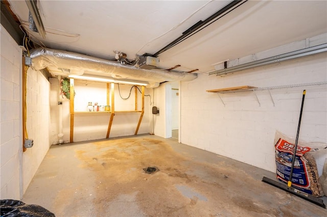 524 Saint Andrews Dr, Hempfield Twp Wml, PA 15601 - garage with a garage door opener and concrete block wall